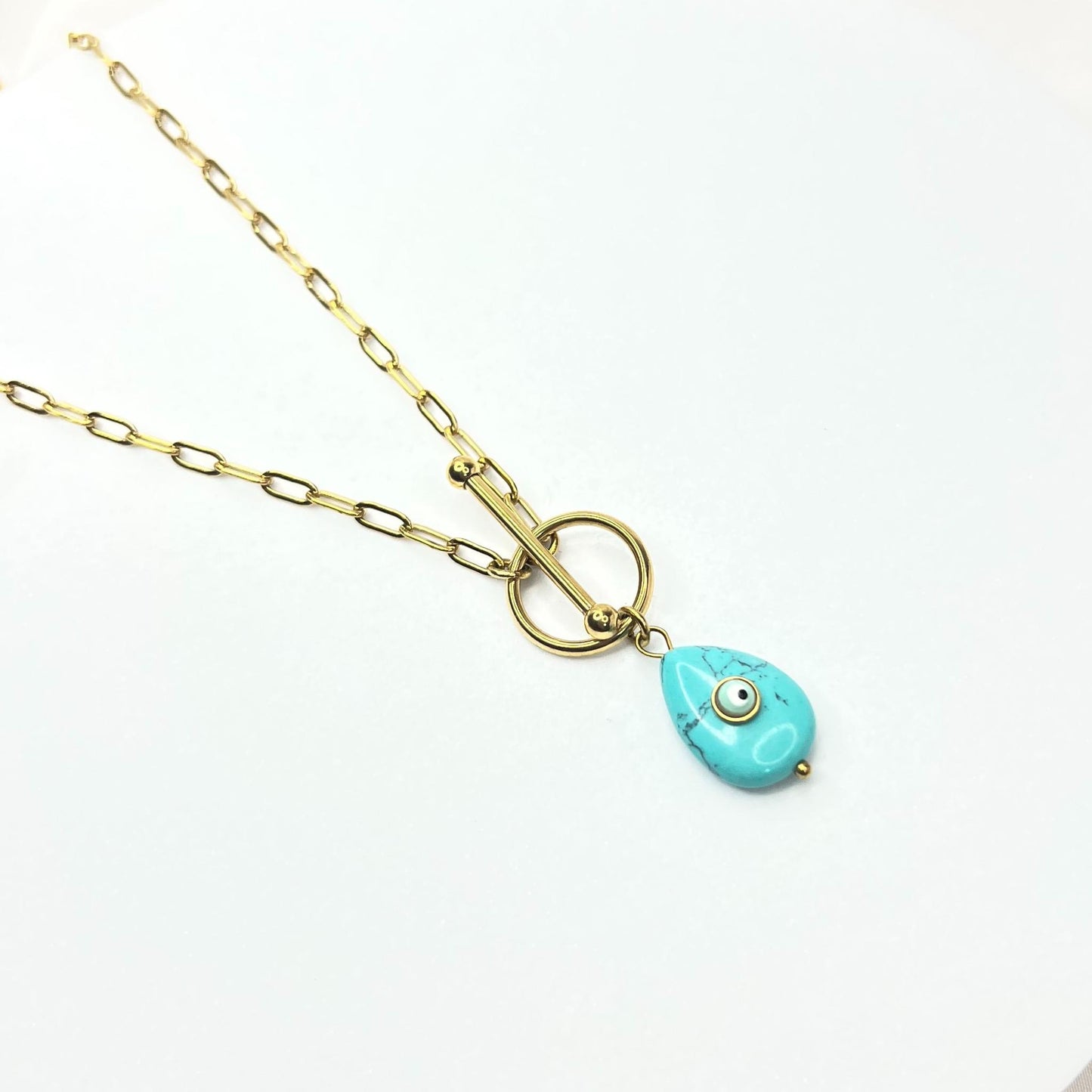 EYE | Necklace with Golden T Clasp and Teardrop Shape Pendant in Mixed Blue
